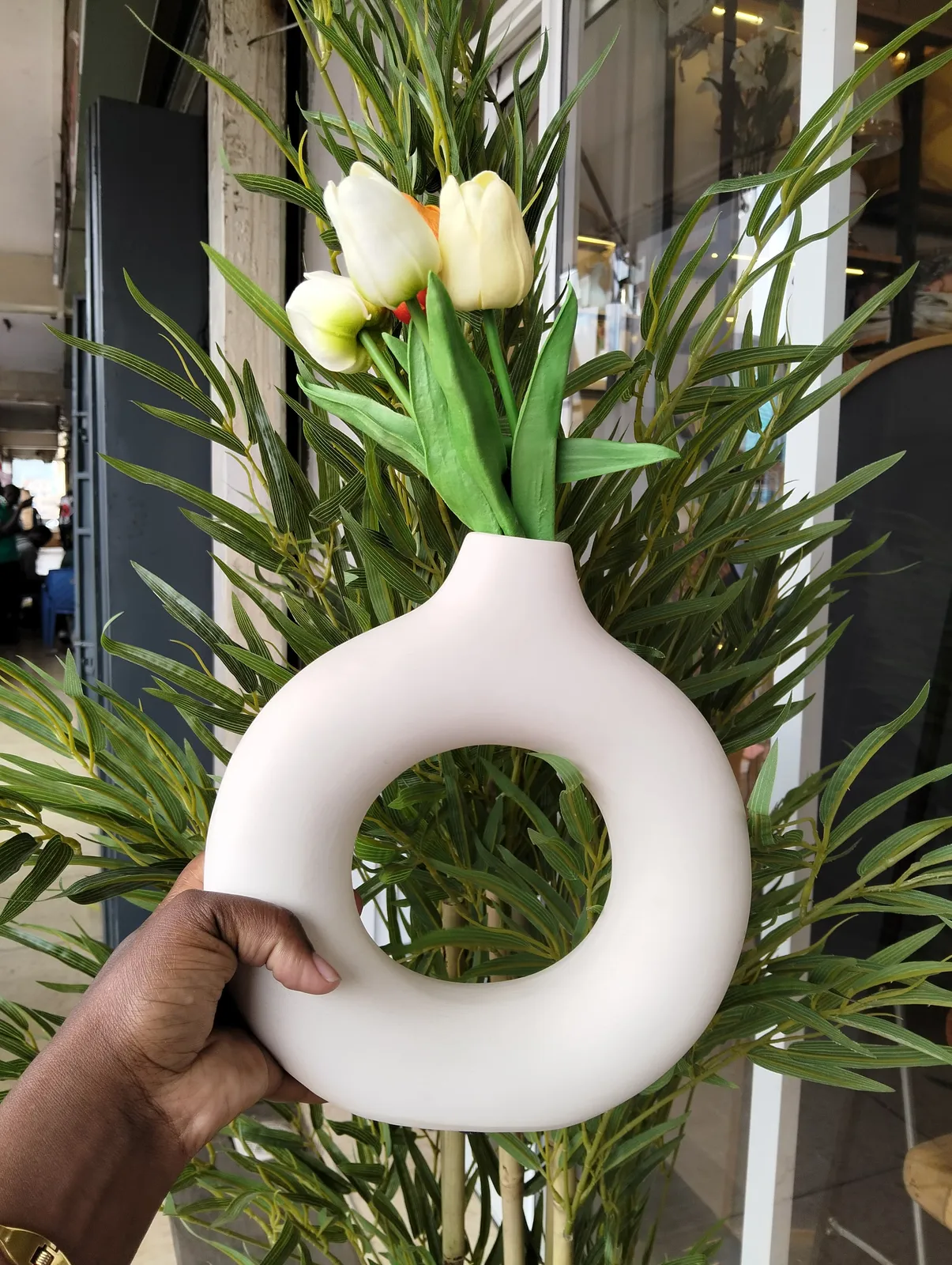 White Donut-Shaped Ceramic Vase with Faux Tulips